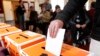 FILE - A vote is cast in Auckland, New Zealand, during a general election on Sept. 3, 2014.