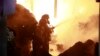 Firefighters put out a fire caused by an explosion at an industrial building in Nairobi, Kenya, Feb. 2, 2024.