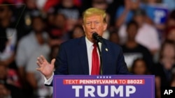 FILE - Republican presidential candidate Donald Trump speaks at a campaign rally, June 22, 2024, in Philadelphia. Trump has sought to distance himself from a plan for a massive overhaul of the federal government drafted by some who served in his 2017-21 administration.