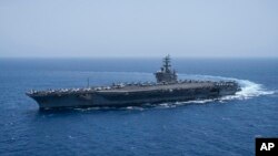 The USS aircraft carrier Dwight D. Eisenhower, also known as 'IKE', sails in the Red Sea on June 12, 2024. 