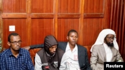 FILE - Suspects Hassan Edin Hassan, Mohamed Abdi Abikar, Rashid Charles Mberesero and Sahal Diriye sit in the dock as they wait for the verdict where they were charged with helping those who carried out the attack on Garissa University, June 19, 2019.