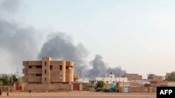 Smoke billows in the distance around the Khartoum Bahri district amid ongoing fighting in Sudan, July 14, 2023. 