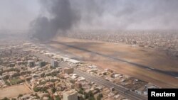 FILE - Smoke rises over the city as army and paramilitaries clash in power struggle, in Khartoum, Apr. 15, 2023 in this picture obtained from social media. (Instagram @lostshmi/via Reuters) 