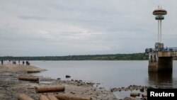 A general view of a city beach covered with rubbish, after a water level in the Dnipro river sharply dropped following Kakhovka dam destruction, in Zaporizhzhia, Ukraine, June 10, 2023.