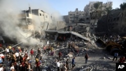 Palestinians look for survivors following an Israeli airstrike at the Khan Younis refugee camp, southern Gaza Strip, Nov. 7, 2023.