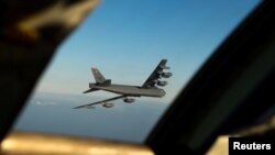 FILE - A B-52 Stratofortress long-range bomber is seen March 28, 2019. (Courtesy Tessa B. Corrick/U.S. Air Force/Handout via Reuters)