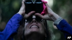 American Biological Anthropologist Karen Strier observes northern muriqui monkeys at the Feliciano Miguel Abdala Private Natural Heritage Reserve, in Caratinga, Minas Gerais state, Brazil, June 14, 2023. (AP Photo/Bruna Prado)
