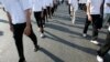 FILE - Civil society groups march as they mark the anniversary of the signing of the Universal Declaration of Human Rights in Phnom Penh, Dec. 10, 2008. Such groups fear budget shrinkage with Sweden ending development cooperation with Cambodia in 2024.