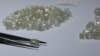 FILE - Diamonds are displayed during a visit to the De Beers Global Sightholder Sales (GSS) in Gaborone, Botswana, Nov. 24, 2015. 