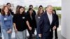 German Chancellor Olaf Scholz, leaves the terrace of the Chancellery with participants after a group picture during an event marking Girls' Day at the Chancellery in Berlin, April 23, 2024. 