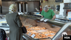 A woman shops at Yasmine Bakery in Dearborn, Michigan, February 26, 2024.