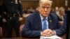 Former President Donald Trump appears at Manhattan criminal court before his trial in New York, April 26, 2024. 