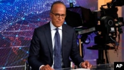 FILE - NBC Nightly News and Dateline anchor Lester Holt poses for photos on the Nightly News set, at NBC headquarters, in New York, July 31, 2019.