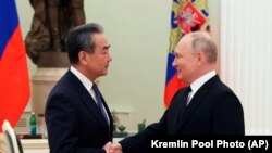 俄罗斯总统普京在克里姆林宫会晤到访的中共中央政治局委员、中央外事办公室主任王毅。（2023年2月22日）
