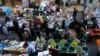 FILE - Iraqi Kurdish people walk in a street market in Erbil, in the Kurdish Region of northern Iraq, Feb. 16, 2016.