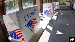 FILE - A ballot completion area in McCandless, Pa., Oct. 9, 2020. A U.S. judge on Tuesday dismissed a lawsuit seeking to force election battleground state Pennsylvania to strengthen its procedures for verifying ballots submitted by military and overseas voters. 
