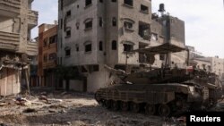 A Merkava tank is seen as Israeli soldiers operate in the Gaza Strip amid the ongoing conflict between Israel and the Palestinian Islamist group Hamas, in this handout picture released on Dec. 17, 2023. (Israel Defense Forces/Handout via Reuters) 