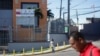 People walk past the Taiwan Embassy after Honduras has given Taiwan 30 days to vacate its embassy after severing relations with Taiwan in favor of China, in Tegucigalpa, Honduras, March 26, 2023.