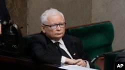 FILE - The leader of Poland's ruling party, Jaroslaw Kaczynski, listens during a parliament vote in Warsaw on Aug. 17, 2023. The Law and Justice party is seeking an unprecedented third term in the October 15 election.