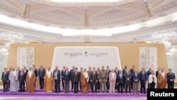 Representatives from more than 40 countries, including the U.S. and China, pose for a group photo as they attend talks in Jeddah, Saudi Arabia, Aug. 6, 2023, to look for ways to end Russia's war in Ukraine. (Saudi Press Agency/Handout via Reuters)