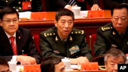 資料照片 -中國新任國防部長李尚福（中）。 2017年10月18日，時任中央軍委裝備發展部部長時出席中共19大開幕式。 （美聯社照片）