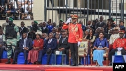 FILE - General Brice Oligui Nguema (C) gives a salute during a military parade in Libreville, Sept. 4, 2023, after being inaugurated as Gabon's interim president.