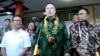 FILE - Elon Musk, center, talks to the media during the launch of Starlink satellite internet service for a facility in Bali, Indonesia, May 19, 2024. Indonesia is wooing Musk to launch more satellites from its territory.