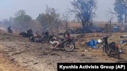 This photo provided by the Kyunhla Activists Group shows aftermath of an airstrike in Pazigyi village in Sagaing Region's Kanbalu Township, Myanmar, Tuesday, April 11, 2023. Witnesses and independent media reports said dozens of villagers in central Myanmar have been killed in an air attack carried out Tuesday by the Southeast Asian country's military government. (Kyunhla Activists Group via AP)