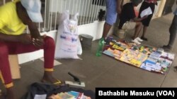 Vendors outside shops in Bulawayo
