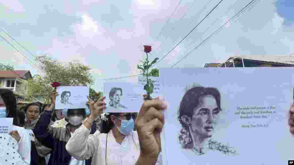 Demonstrators hold papers printed with Aung San Suu Kyi’s famous quote as they rally to mark her 79th birthday in Launglon township in Tanintharyi region, Myanmar.