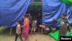 FILE - People displaced by fighting in north-western Myanmar between junta forces and anti-junta fighters are seen at a camp in Chin State, Myanmar, May 31, 2021.