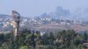 Smoke rises above Lebanon, amid cross-border hostilities between Hezbollah and Israeli forces, as seen from northern Israel, July 25, 2024. 