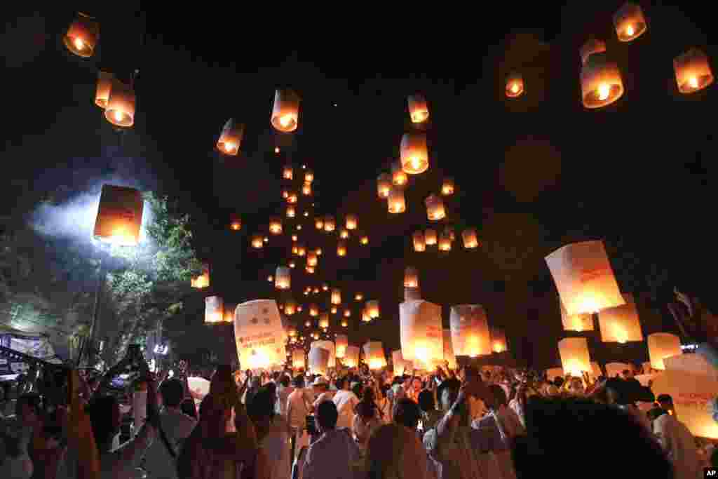 People release lanterns during the celebration of Vesak, which marks the day of Buddha's birth, death and enlightenment at the 9th century Borobudur Temple in Magelang, Central Java, Indonesia.