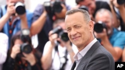 FILE - Tom Hanks poses for photographers at the photo call for the film 'Elvis' at the 75th international film festival, Cannes, southern France, May 26, 2022. 