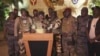 This video grab shows the spokesperson for the mutinous soldiers speaking on state television as they announce that they had seized power in Libreville, Gabon, Aug. 30, 2023. (GABON 24 via AP)