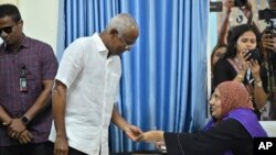 President of the Maldives Ibrahim Mohamed Solih Casts his vote at a polling station in Male, Maldives, Sept. 9, 2023. 