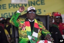 Zimbabwe's President Emmerson Mnangagwa signals to the crowd at a campaign rally in Harare on Aug. 9, 2023. The 80-year-old Mnangagwa is seeking re-election for a second term.