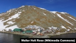 Drone photo of the city of Diomede, located on the west coast of Little Diomede Island in the Behring Strait, is the most remote community in the U.S.