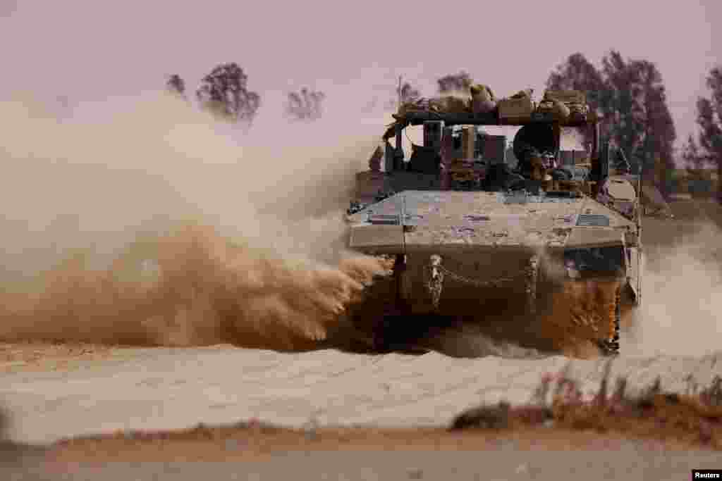 An APC maneuvers near the Israel-Gaza border, amid the ongoing conflict between Israel and the Palestinian Islamist group Hamas, in Israel.