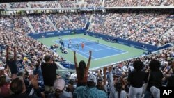 Fans cheer during a match between Beatriz Haddad Maia, of Brazil, and Sloane Stephens, of the U.S. during the U.S. Open tennis championships, in New York, Aug. 28, 2023. Some players say they've smelled cannibas at Court 17, which is next to a park.
