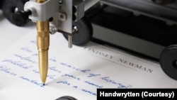 A robotic arm created by the Handwrytten company writes a "personalized" letter for a business client that wants to foster better communication with its customers.