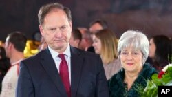 FILE - U.S. Supreme Court Justice Samuel Alito, left, and his wife Martha-Ann Alito pay their respects at the casket of Reverend Billy Graham at the Rotunda of the U.S. Capitol building in Washington, Feb. 28, 2018.