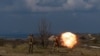 A Ukrainian soldier fires a RPG in a training camp just outside of Siversk, one of the many towns in the Donbas region badly affected by the war, April 4, 2023. 