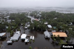 A drone view shows houses and streets flooded as Hurricane Debby affects the gulf coast in Suwannee, Florida, Aug. 5, 2024.