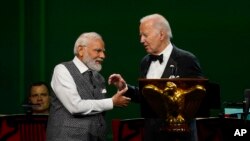 President Joe Biden talks with India's Prime Minister Narendra Modi at a state dinner at the White House in Washington, June 22, 2023.