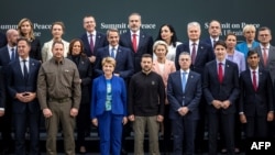 Ukrainian President Volodymyr Zelenskyy, front row, middle, poses with other world leaders for a photograph during a peace summit near Lucerne, Switzerland, June 15, 2024. 
