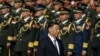 资料照片: 2023年9月30日中国国家主席习近平人民英雄纪念碑献花，纪念烈士纪念日，身后是中国人民解放军官兵