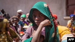 Mkimbizi kutoka Jamhuri ya Kidemokrasia ya Kongo akiwa katika Kituo cha Nyakabande Transit Center huko Kisoro, Uganda, Juni 7, 2022, Picha na BADRU KATUMBA/AFP.