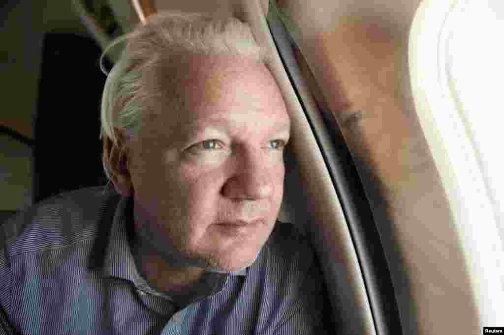 WikiLeaks founder Julian Assange looks out a plane window as he approaches Bangkok airport for a layover, according to a post by Wikileaks on X. Assange has been released from prison in Britain and is set to face a final court hearing after reaching a plea deal with U.S. authorities that brings to a close his years-long legal drama. 