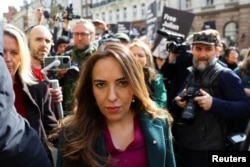 FILE - Stella Assange, the wife of WikiLeaks founder Julian Assange walks, on the day the High Court is set to rule on whether Julian Assange can appeal against extradition from Britain to the United States, in London, March 26, 2024.